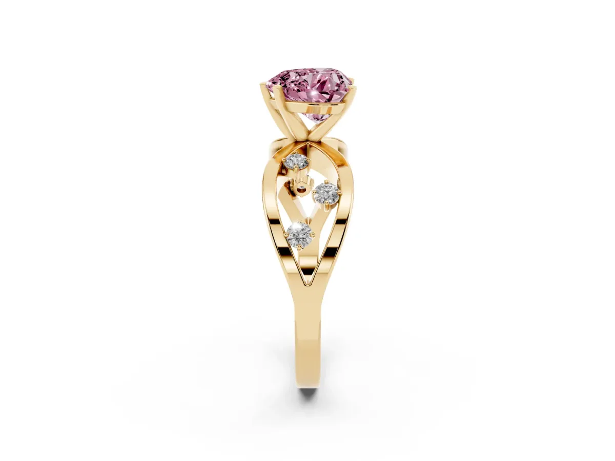 Fancy Pink Heart Cut Cut Solitaire Diamond with Side Stones on Criss-Cross Band and Four-Prong Setting Yellow gold