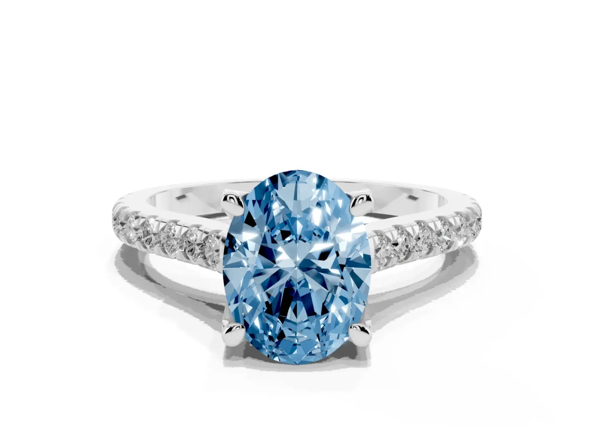 Fancy Blue Oval Cut Brilliant Diamond Solitaire with Pavé Band and Four-Prong Setting Platinum