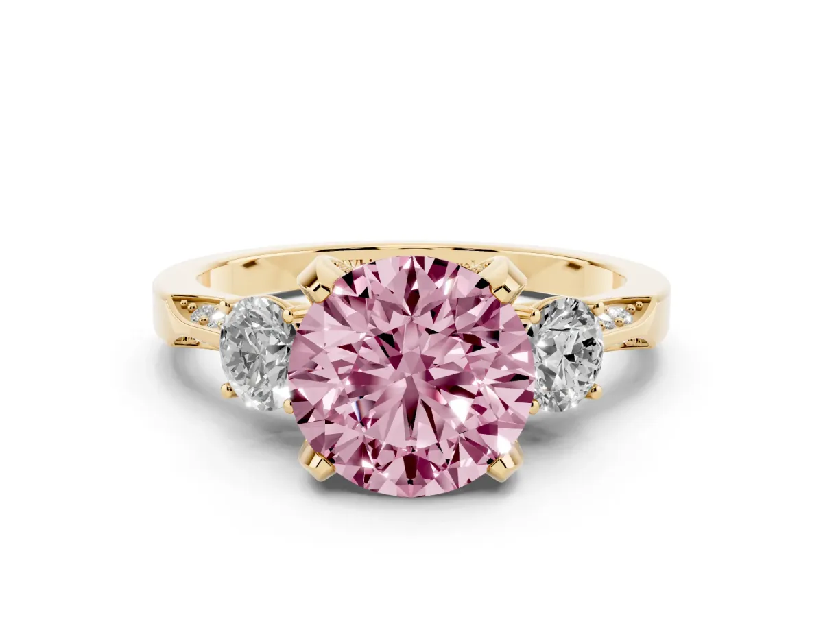 Fancy Pink Round Cut Brilliant Three-Stone Diamond Ring with Pavé Band and Four-Prong Setting Yellow gold