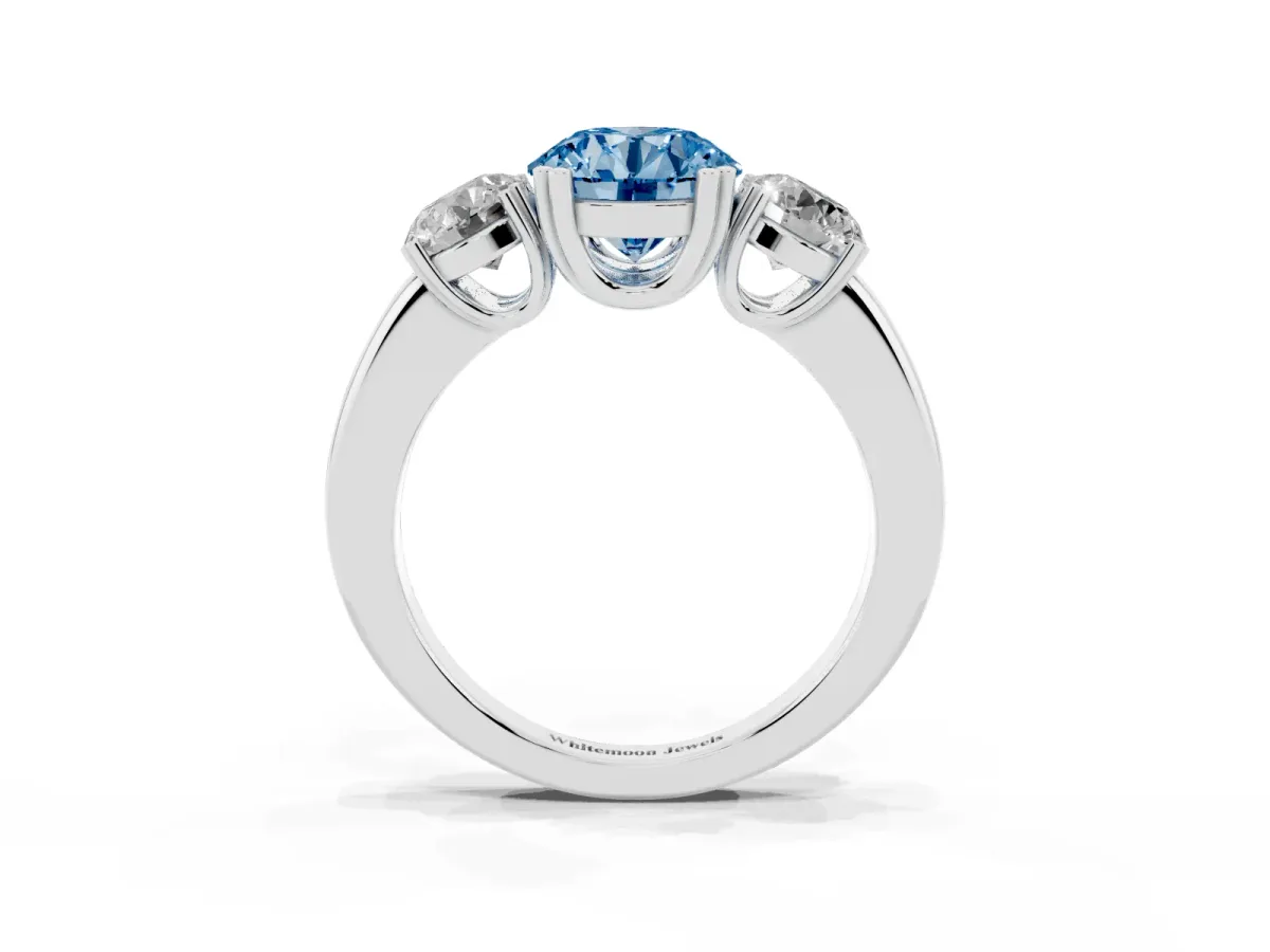 Fancy Blue Three-Stone Round Cut Cut Diamond Ring with Channel Set Band and Four-Prong Setting Silver