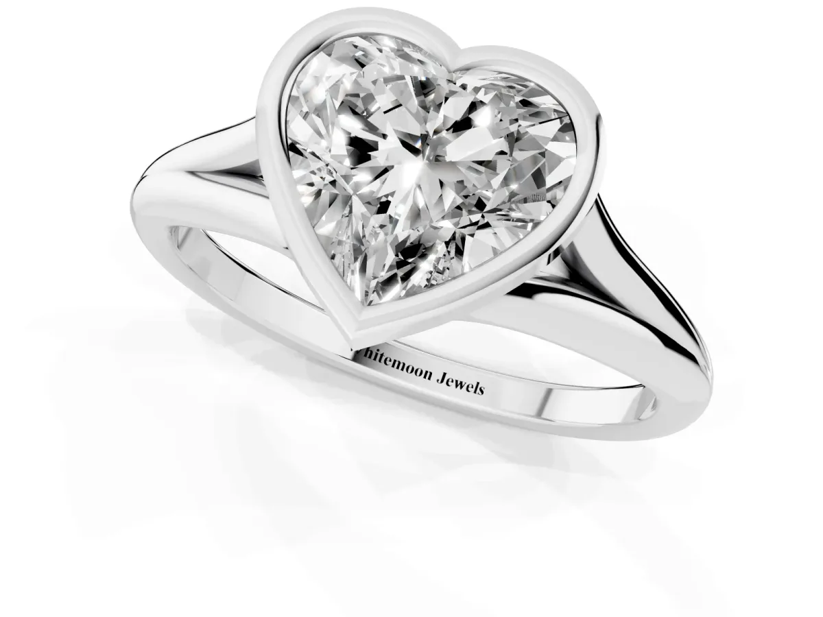 Bezel Set Heart Cut Cut Solitaire Ring with Tapered Band Silver