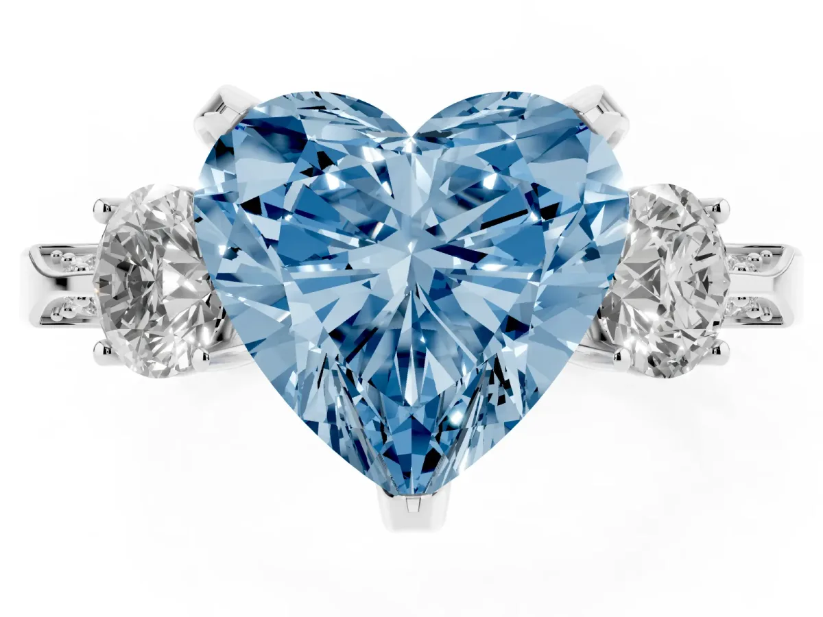 Fancy Blue Heart Cut Brilliant Three-Stone Diamond Ring with Pavé Band and Four-Prong Setting Platinum