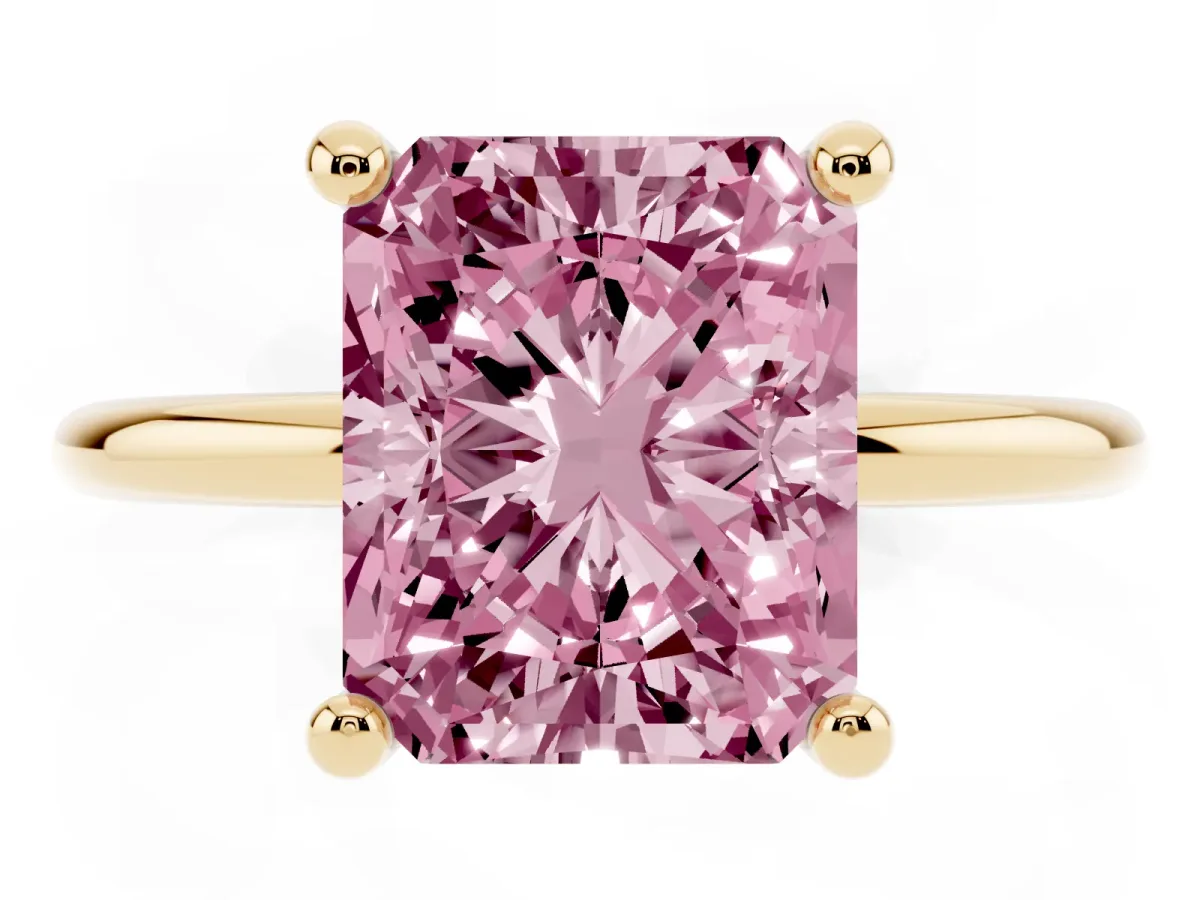 Fancy Pink Radiant Cut Solitaire Diamond Ring with 4-Prong Setting on a Classic Band Yellow gold