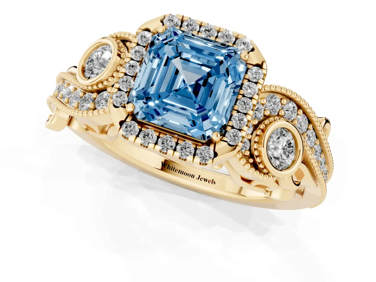 Fancy Blue Asscher Cut Diamond Halo Ring with Milgrain Pavé Band and Four-Prong Setting Yellow gold