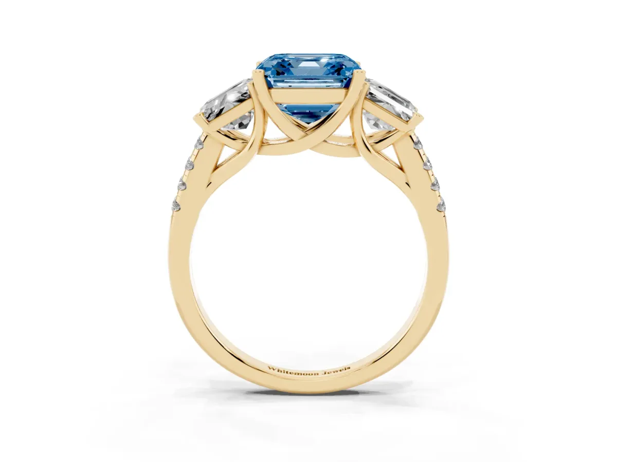 Fancy Blue Three-Stone Asscher Cut Diamond Ring with Round Pavé Band and Prong Setting Yellow gold