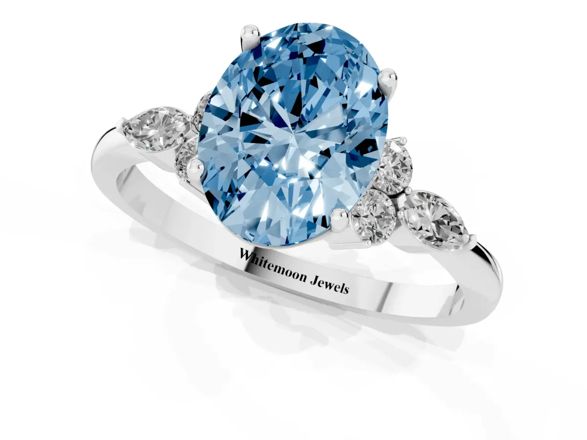 Fancy Blue Oval Cut Brilliant Diamond Solitaire Ring with Pear Side Stones and Four-Prong Setting Silver