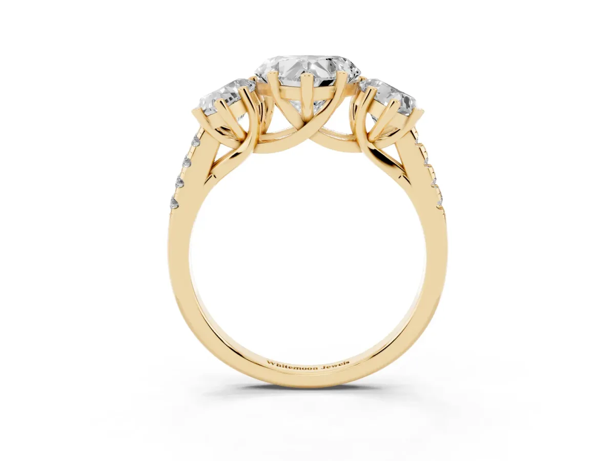 Three-Stone Heart Cut Diamond Ring with Round Pavé Band and Prong Setting Yellow gold