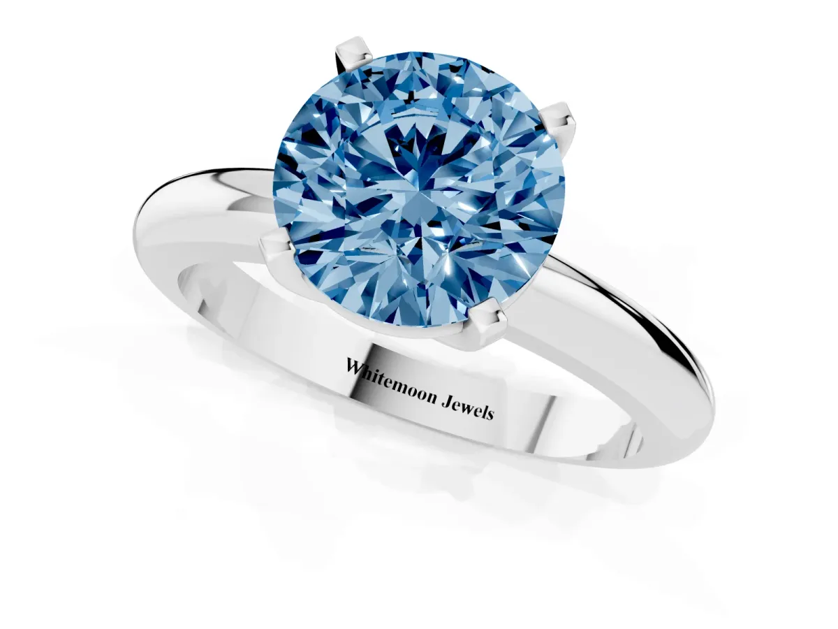 Fancy Blue Round Cut Diamond Solitaire Engagement Ring with Round Band and Four-Prong Setting Silver