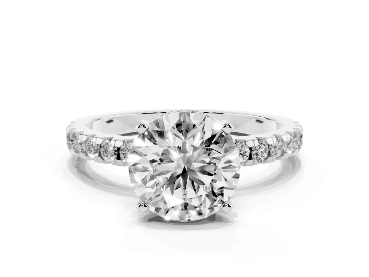 Round Cut Diamond Solitaire Ring with Round Pavé Band and Four-Prong Setting Silver