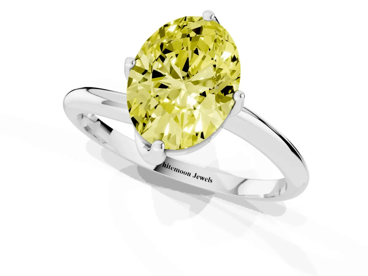 Fancy Yellow Oval Cut Diamond Solitaire Engagement Ring with Four-Prong Setting and Classic Band Silver