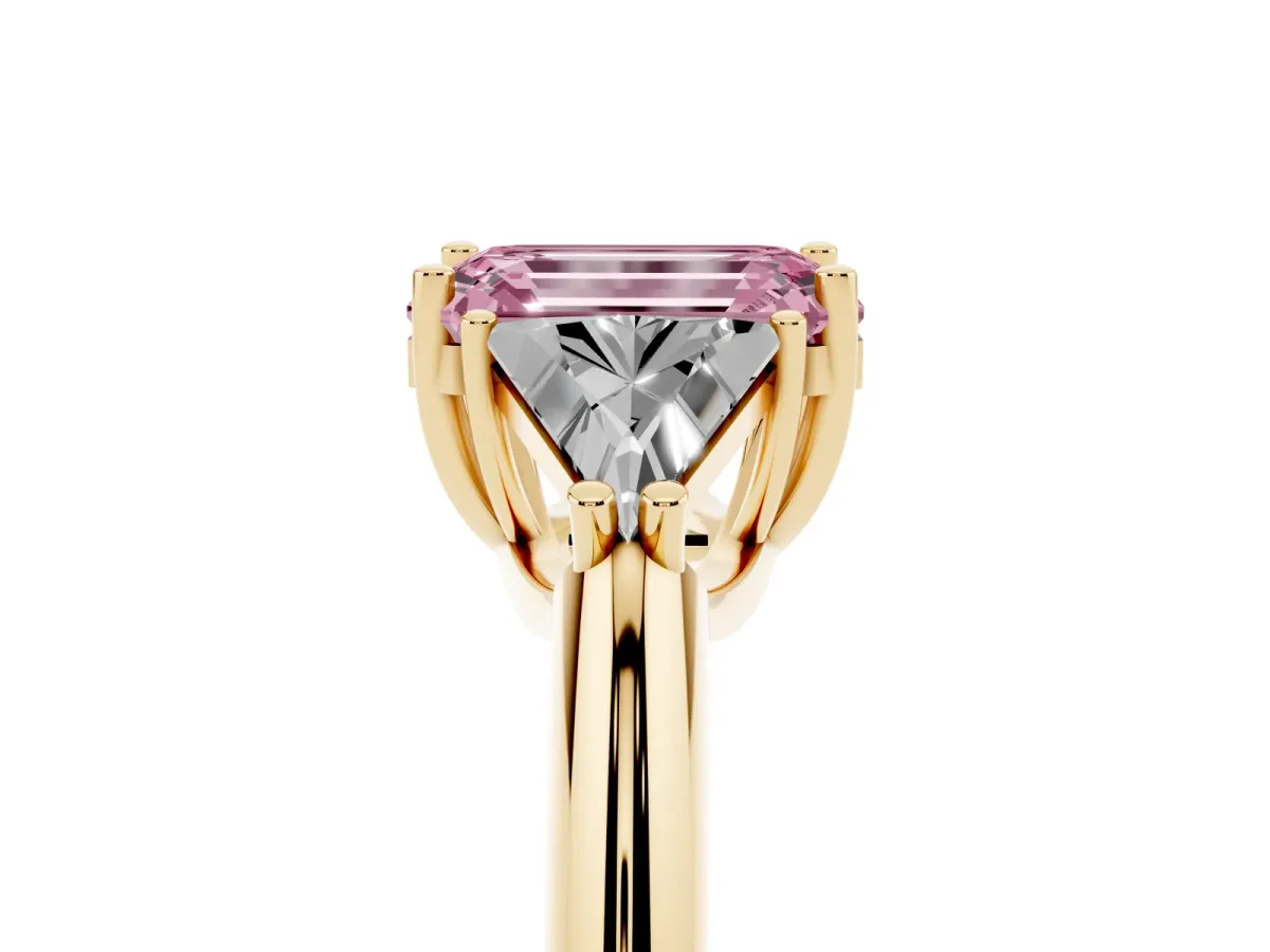 Fancy Pink Three-Stone Emerald Cut Diamond Engagement Ring with Trillion Side Stones and Prong Setting Yellow gold