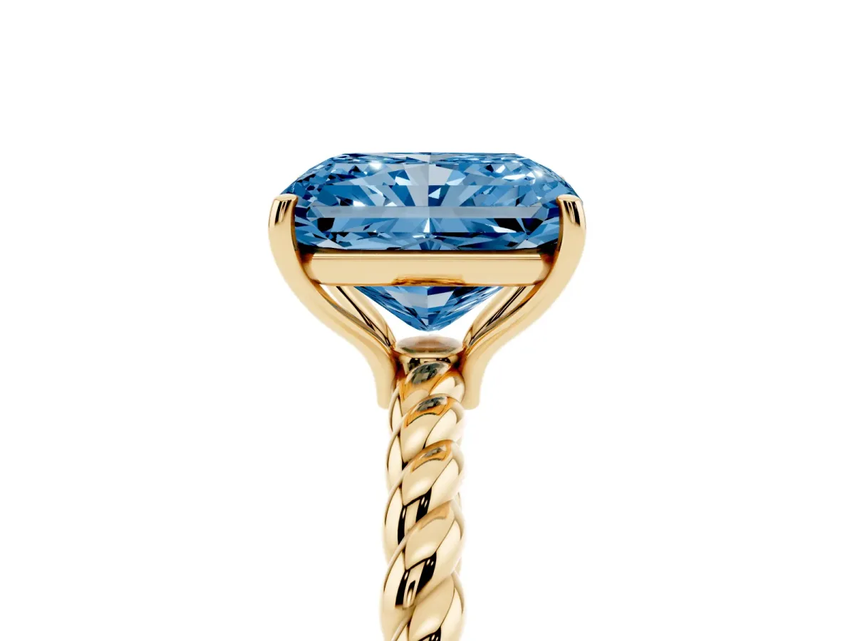 Fancy Blue Radiant Cut Solitaire Twist Band Ring with Four-Prong Setting Yellow gold