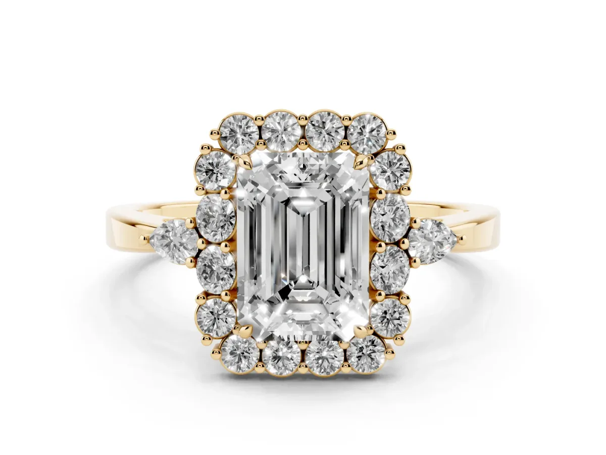 Emerald Cut Diamond Halo Ring with Pear Side Stones and Prong Setting Yellow gold