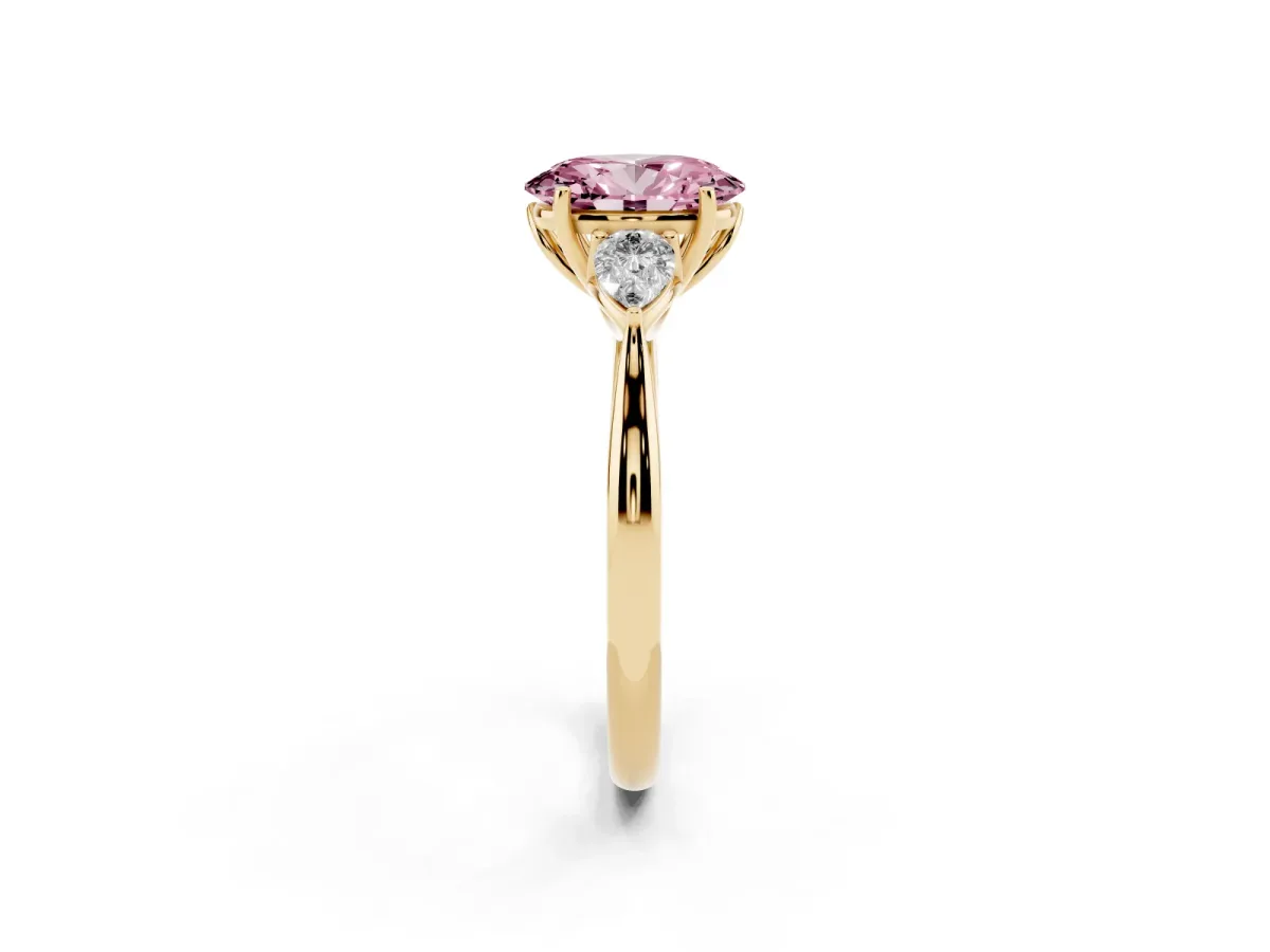 Fancy Pink Oval Cut Diamond Three-Stone Ring with Pear Side Stones and Prong Setting Yellow gold