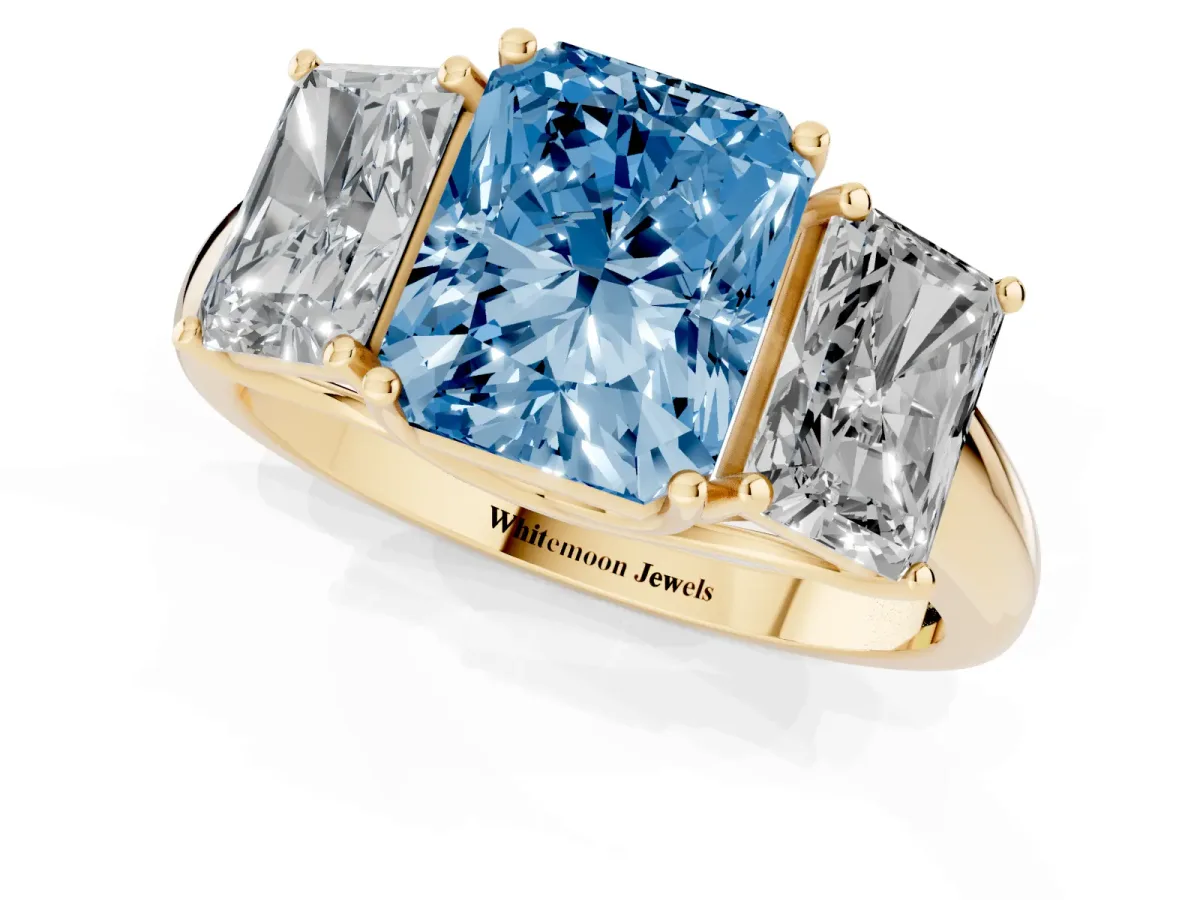 Fancy Blue Three-Stone Radiant Cut Diamond Engagement Ring with Prong Setting Yellow gold