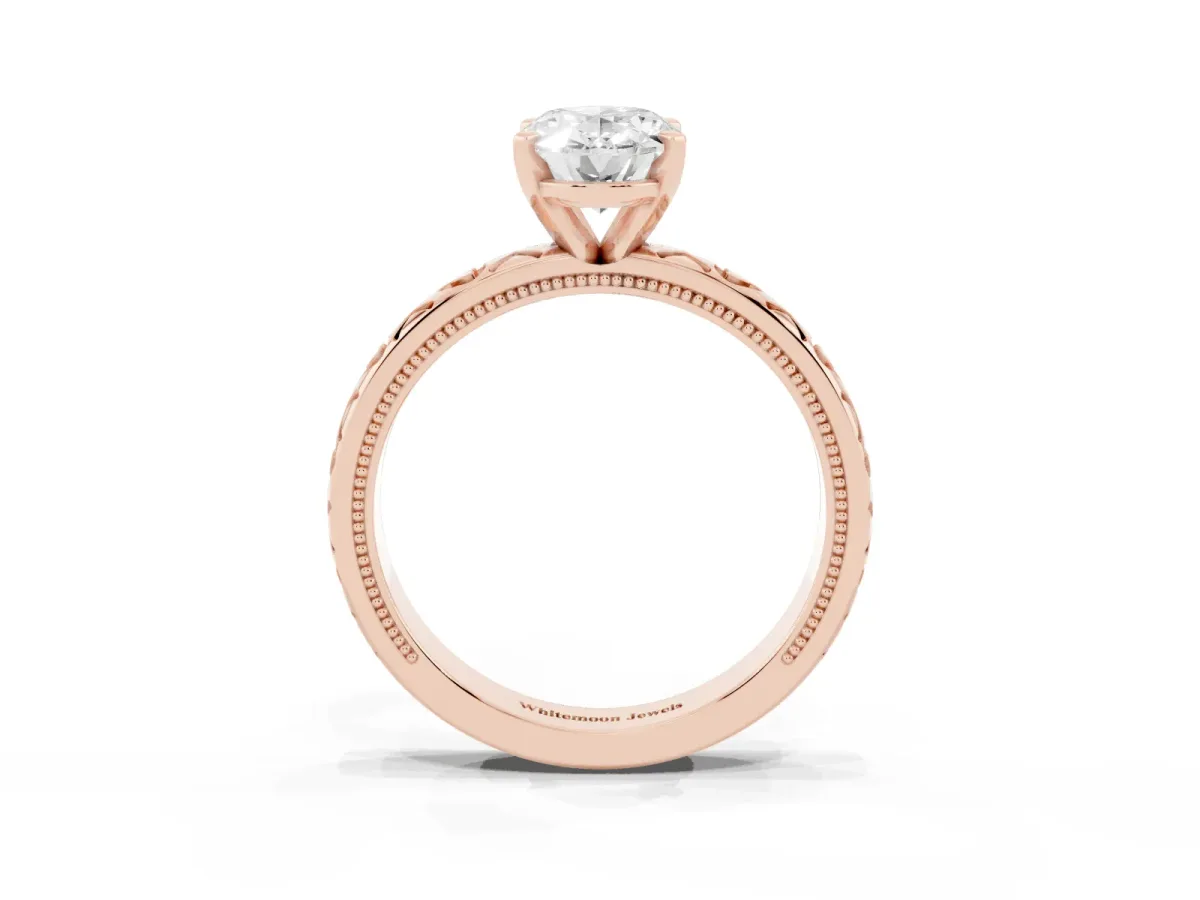 Oval Cut Solitaire Diamond Engagement Ring with XO Engraved Band and Four-Prong Setting Rose gold