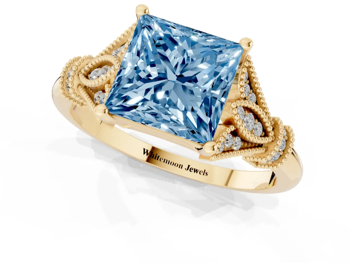 Fancy Blue Princess Cut Diamond Solitaire Ring with Floral Filigree and Pave Accents Yellow gold