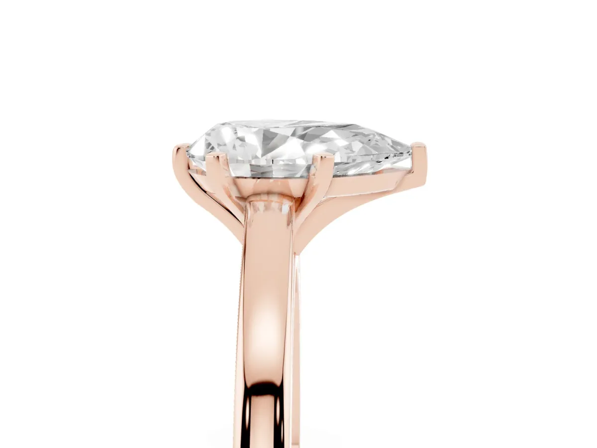 Pear Cut Solitaire Diamond Engagement Ring with Four-Prong Setting on a Classic Band Rose gold