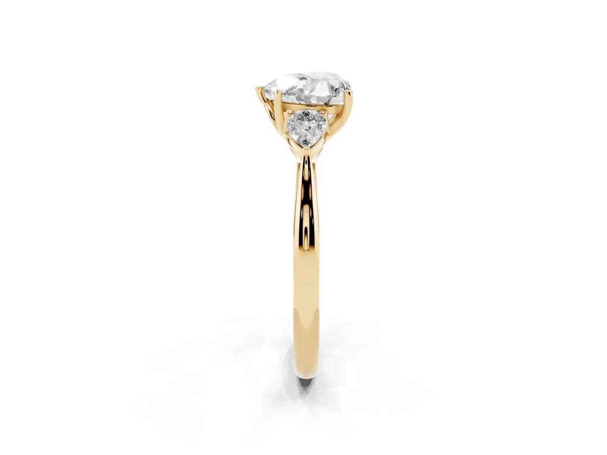 Heart Cut Diamond Three-Stone Ring with Pear Side Stones and Prong Setting Yellow gold