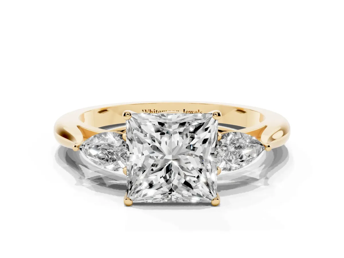 Princess Cut Diamond Three-Stone Ring with Pear Side Stones and Prong Setting Yellow gold