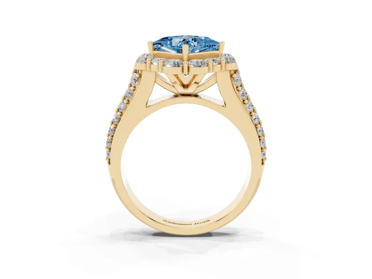 Fancy Blue Princess Cut Halo Diamond Engagement Ring with Split Shank and Prong Setting Yellow gold
