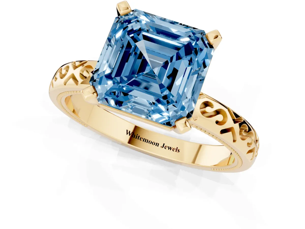 Fancy Blue Asscher Cut Solitaire Engagement Ring with Scrollwork Band and Four-Prong Setting Yellow gold