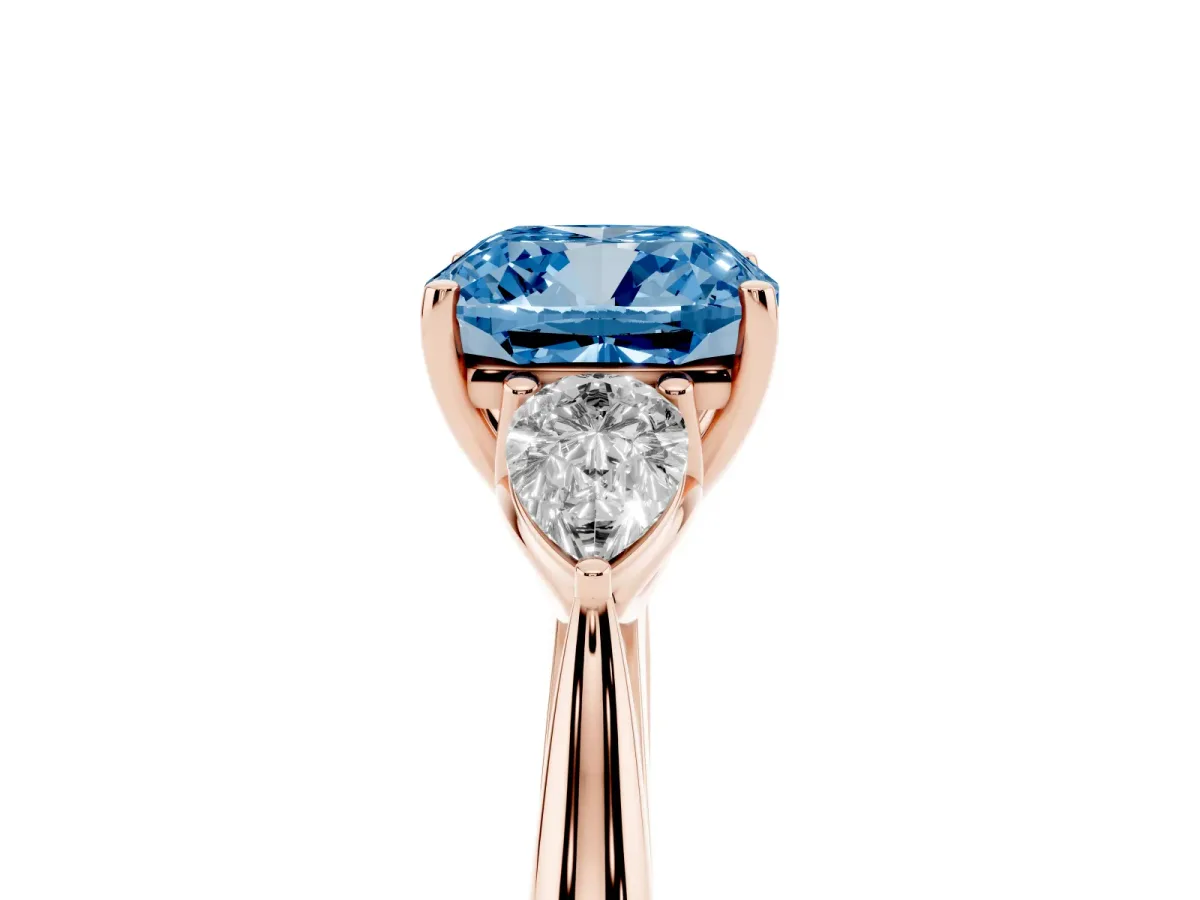 Fancy Blue Three-Stone Cushion Cut Diamond Ring with Pear Side Stones in Four-Prong Setting Rose gold