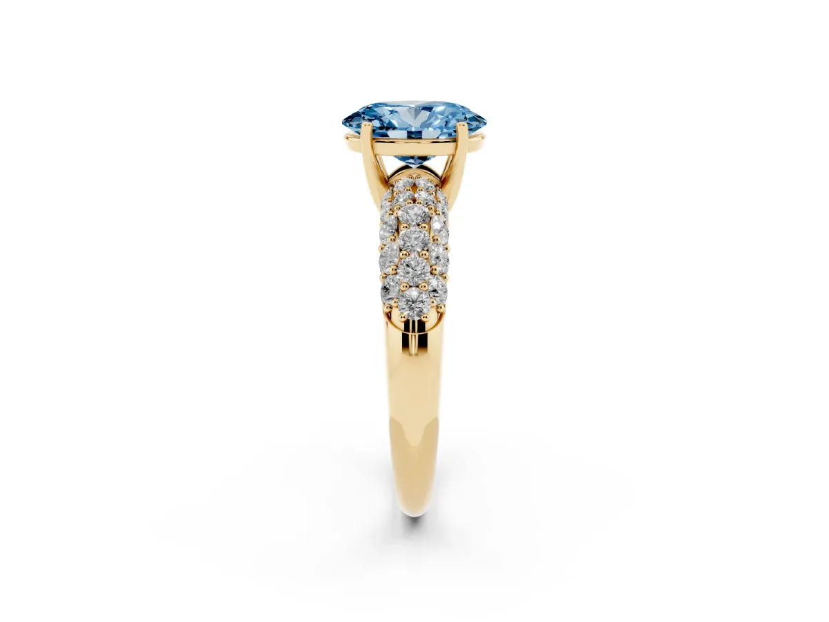 Fancy Blue Oval Cut Diamond Pavé Band Solitaire Ring with Four-Prong Setting Yellow gold