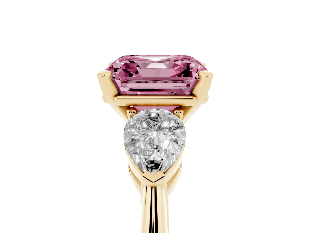 Fancy Pink Three-Stone Asscher Cut Diamond Ring with Pear Side Stones and Four-Prong Setting Yellow gold