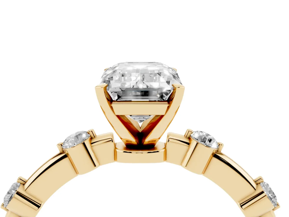 Emerald Cut Solitaire Diamond Ring with Bezel Set Side Stones and Prong Setting Yellow gold