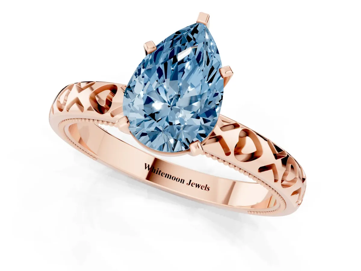Fancy Blue Pear Cut Solitaire Diamond Engagement Ring with XO Engraved Band and Four-Prong Setting Rose gold
