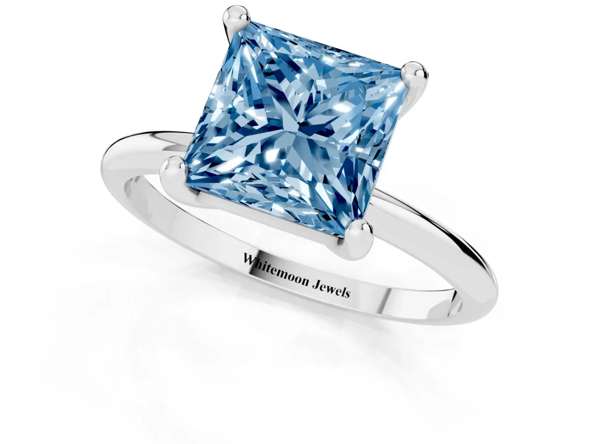 Fancy Blue Princess Cut Solitaire Diamond Ring with 4-Prong Setting on a Classic Band Silver