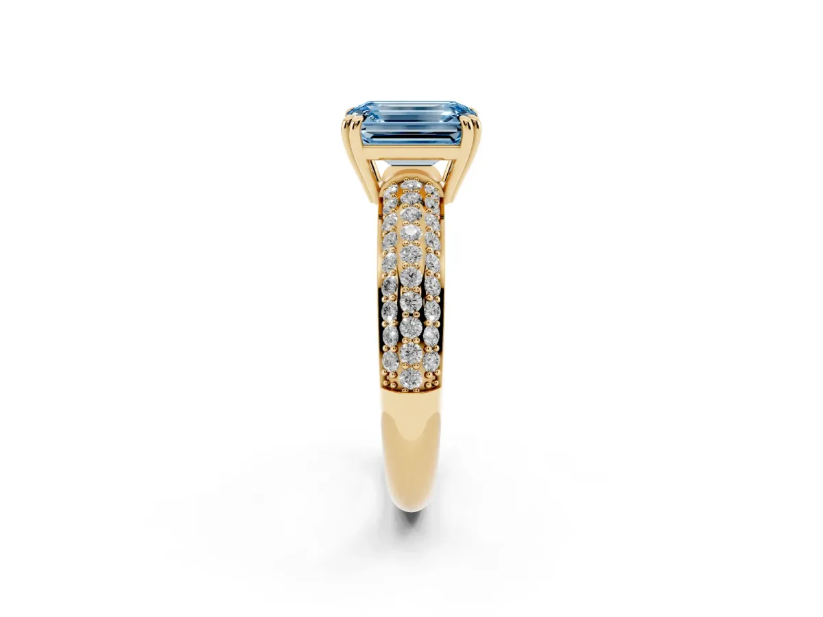 Fancy Blue Emerald Cut Diamond Solitaire Ring with Multi-Row Round Pavé Band and Prong Setting Yellow gold