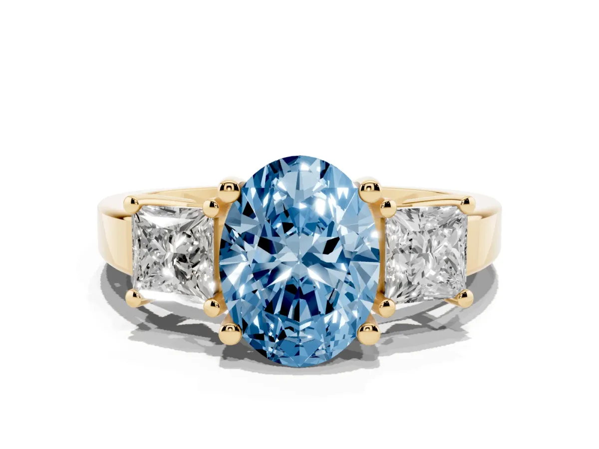 Fancy Blue Three-Stone Oval Cut Cut Solitaire Ring with Prong Setting Yellow gold