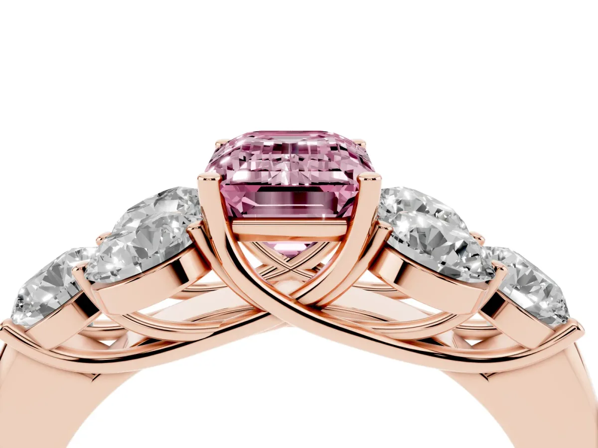 Fancy Pink Emerald Cut Cut Diamond Cluster Ring with Round Accent Stones and Prong Setting on a Classic Band Rose gold