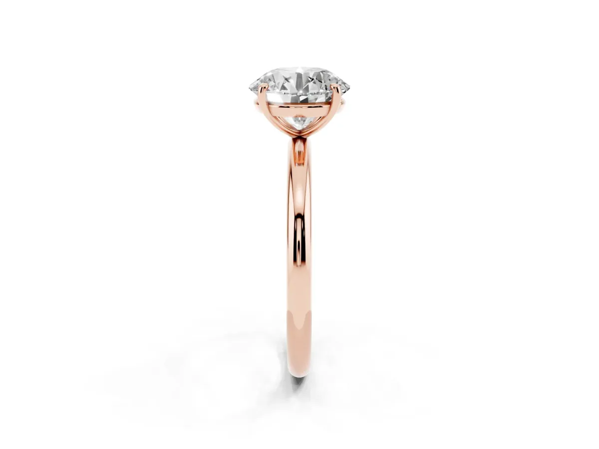 Round Cut Solitaire Diamond Ring with Four-Prong Setting on a Plain Band Rose gold