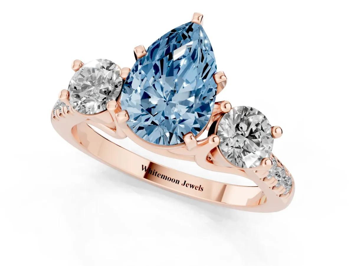 Fancy Blue Three-Stone Pear Cut Diamond Pavé Band with Four-Prong Setting Rose gold