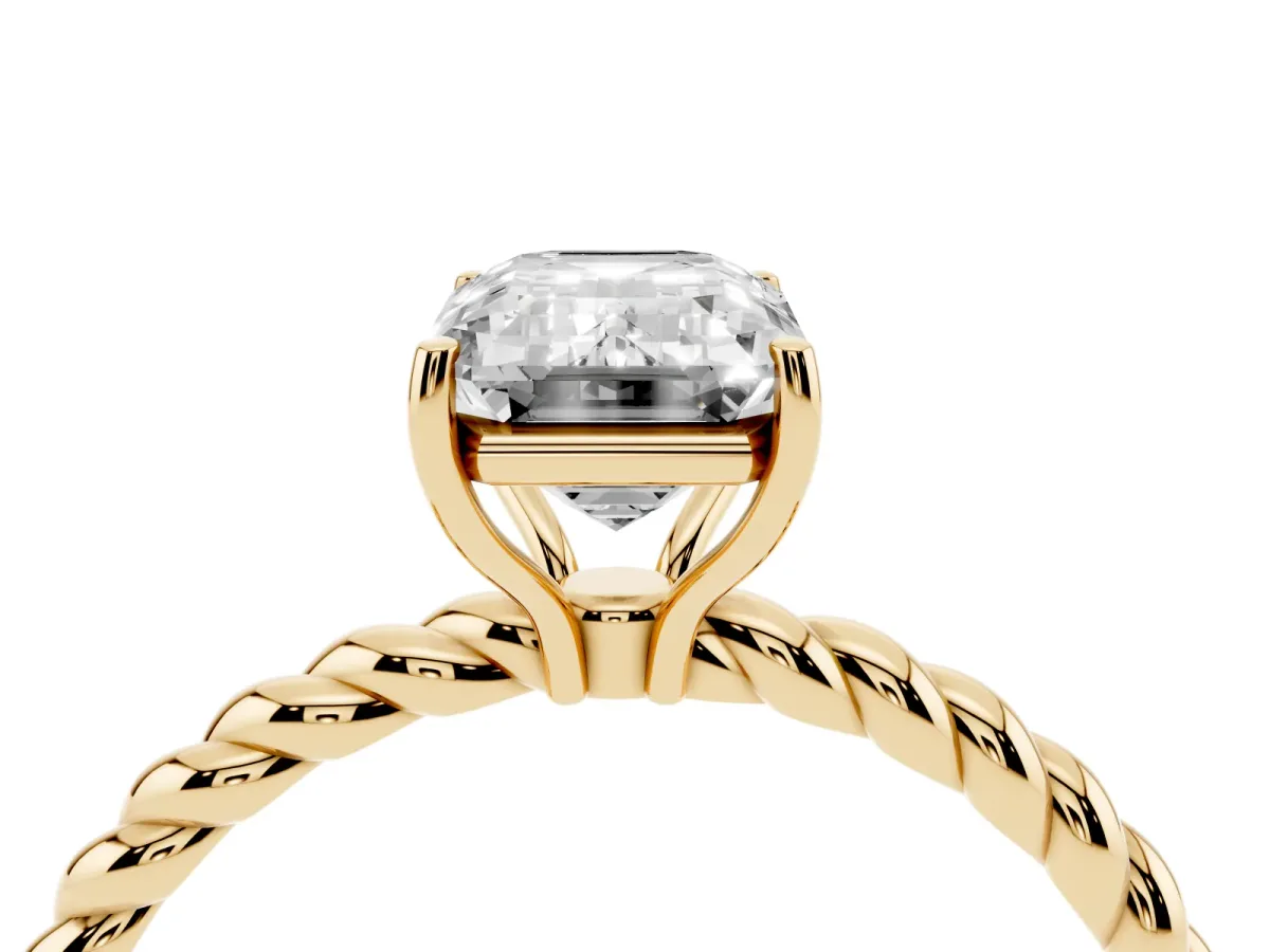 Emerald Cut Solitaire Twist Band Ring with Four-Prong Setting Yellow gold