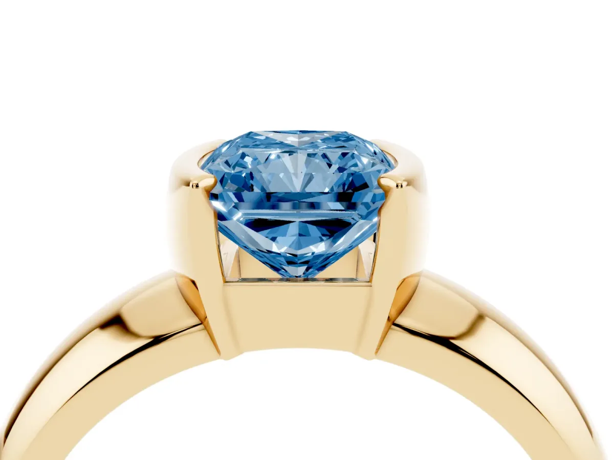 Fancy Blue Radiant Cut Solitaire Tension Set Diamond Ring with Wide Band Yellow gold