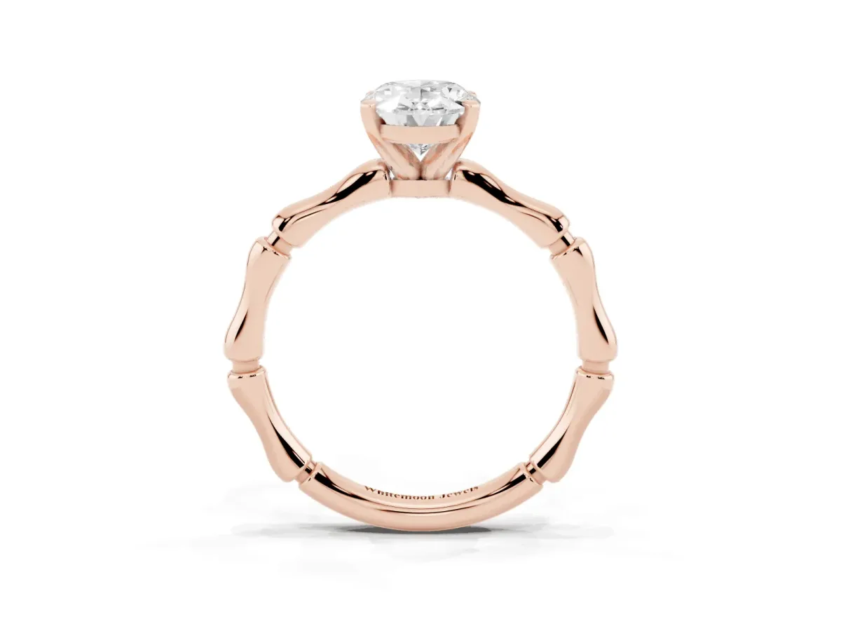 Oval Cut Solitaire Diamond Ring with Bamboo Band and Four-Prong Setting Rose gold