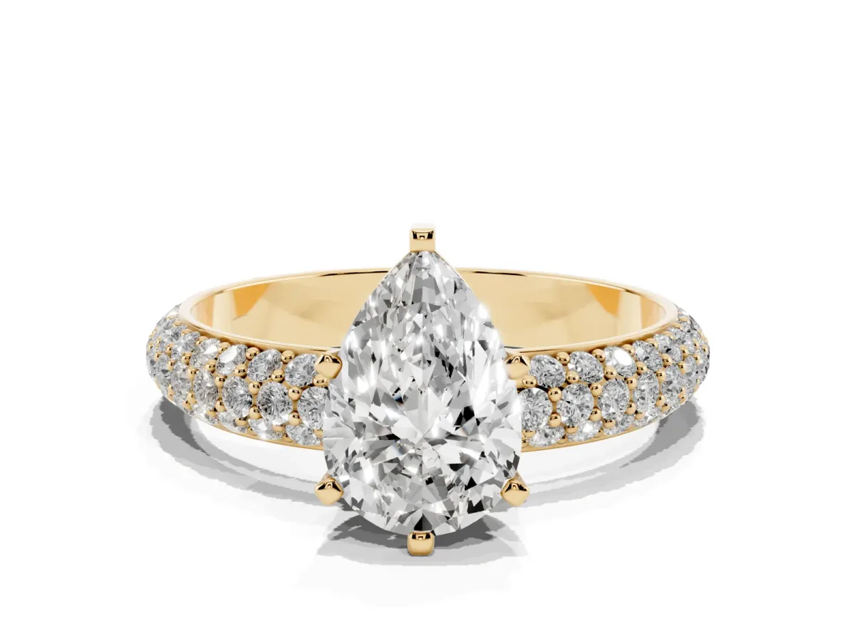 Pear Cut Diamond Solitaire Ring with Prong Setting and Pavé Band Yellow gold