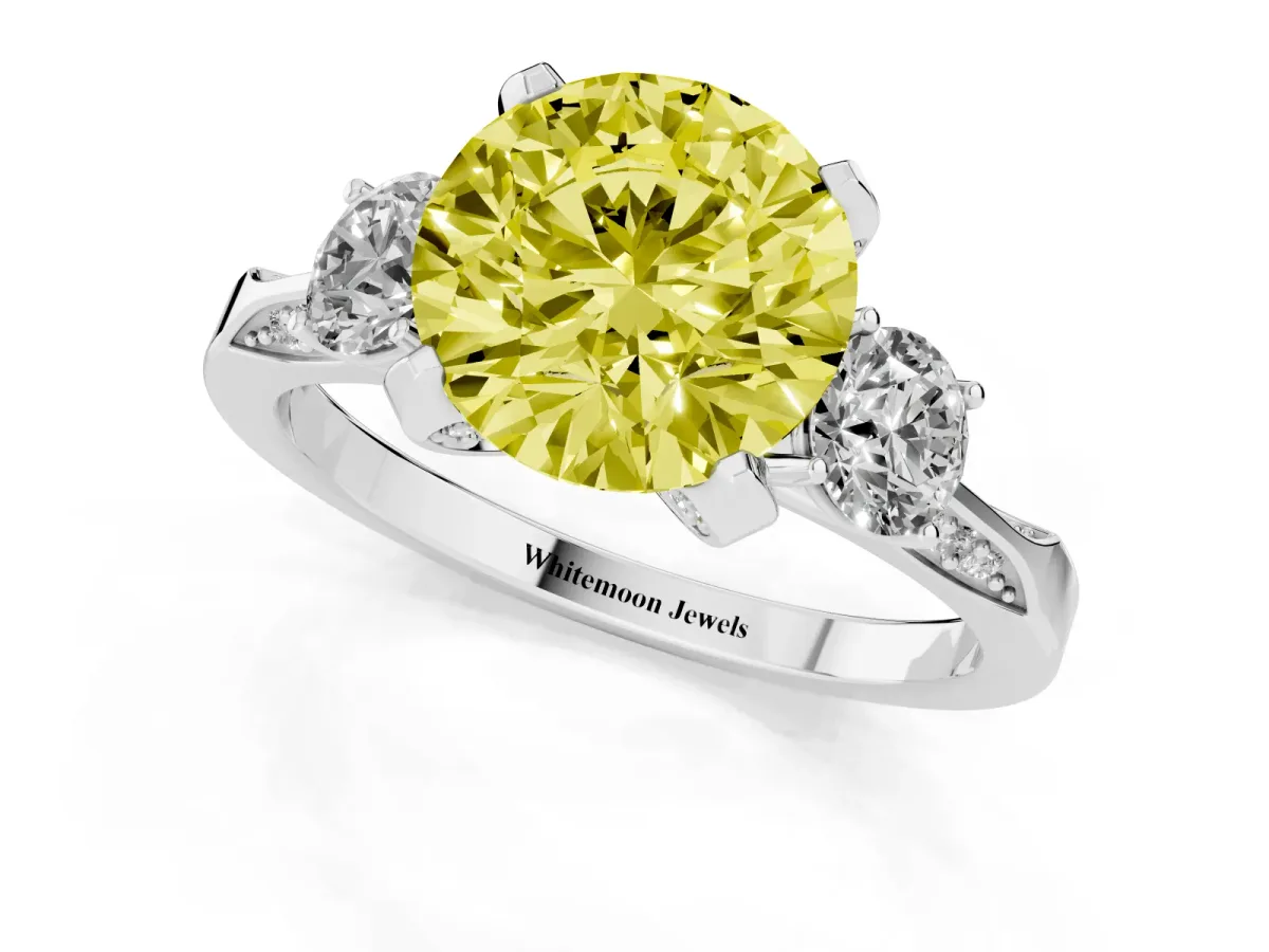 Fancy Yellow Round Cut Brilliant Three-Stone Diamond Ring with Pavé Band and Four-Prong Setting Platinum