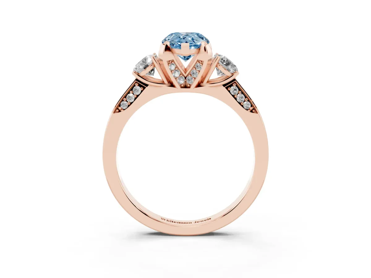 Fancy Blue Pear Cut Brilliant Three-Stone Diamond Ring with Pavé Band and Four-Prong Setting Rose gold