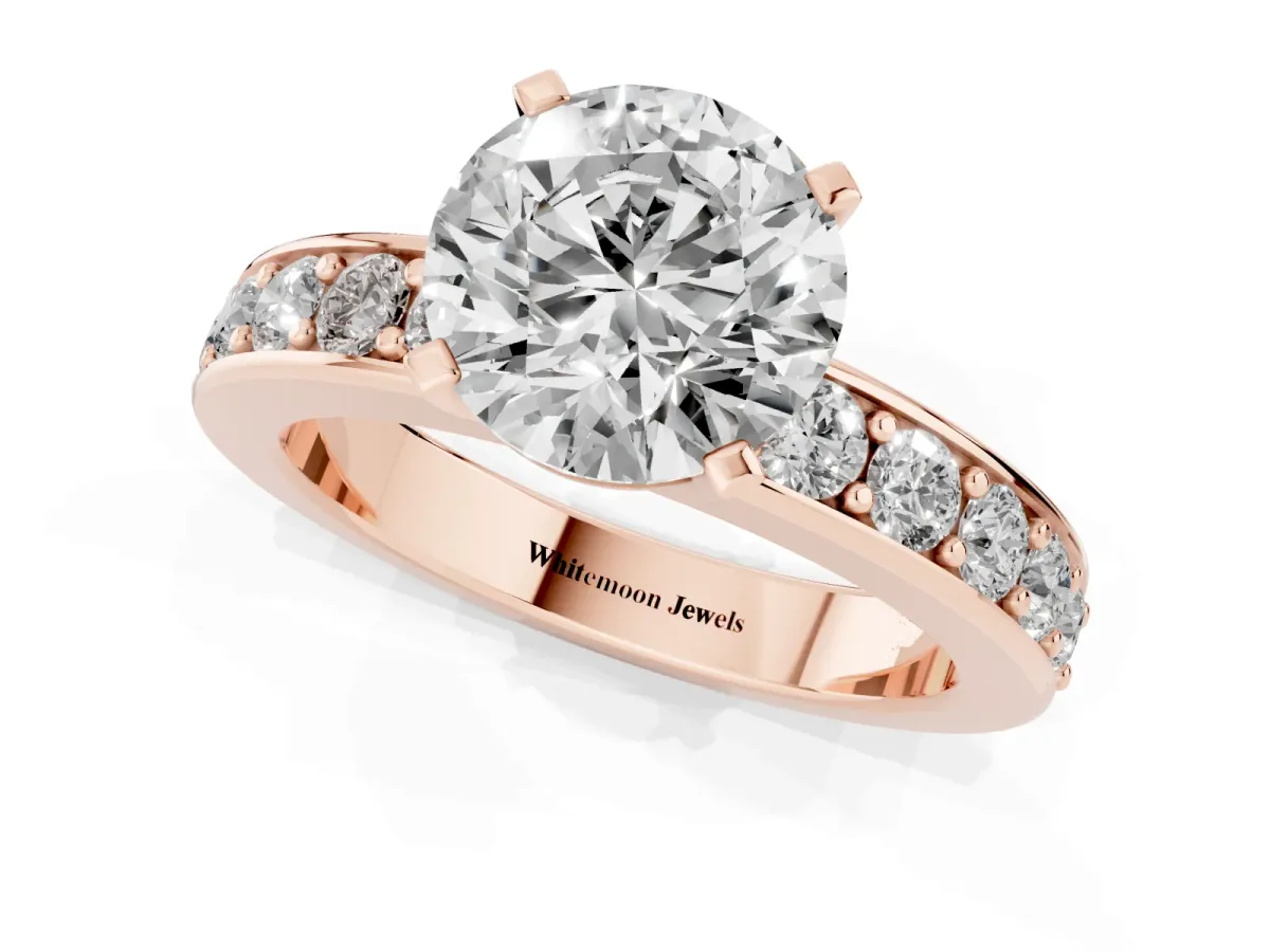 Round Cut Diamond Engagement Ring with Channel Set Round Band and Prong Setting Rose gold