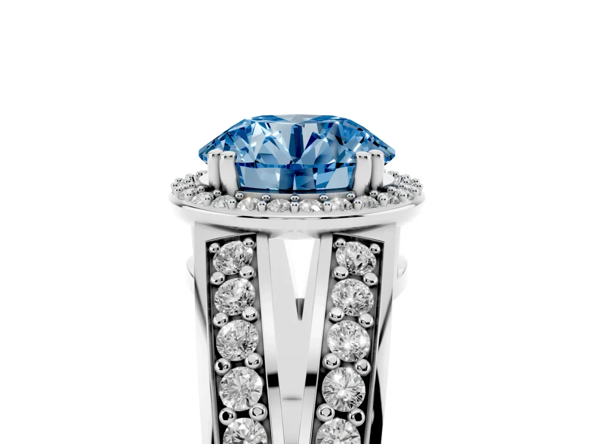 Fancy Blue Round Cut Diamond Halo Ring with Split Shank Pavé Band and Four-Prong Setting Silver