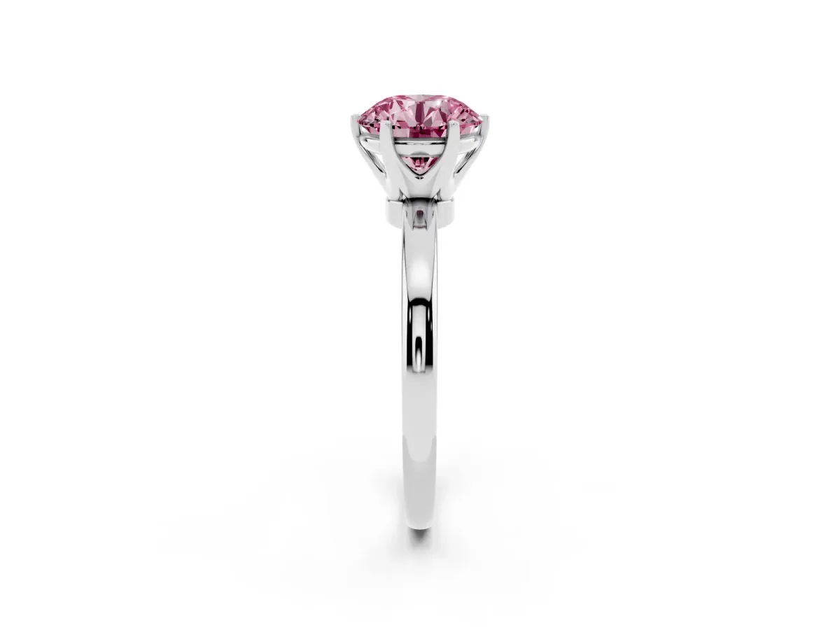 Fancy Pink Round Cut Solitaire Diamond Ring with Six-Prong Setting on a Classic Band Platinum