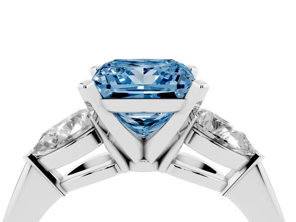 Fancy Blue Three-Stone Princess Cut Diamond Ring with Pear Side Stones and Four-Prong Setting Platinum