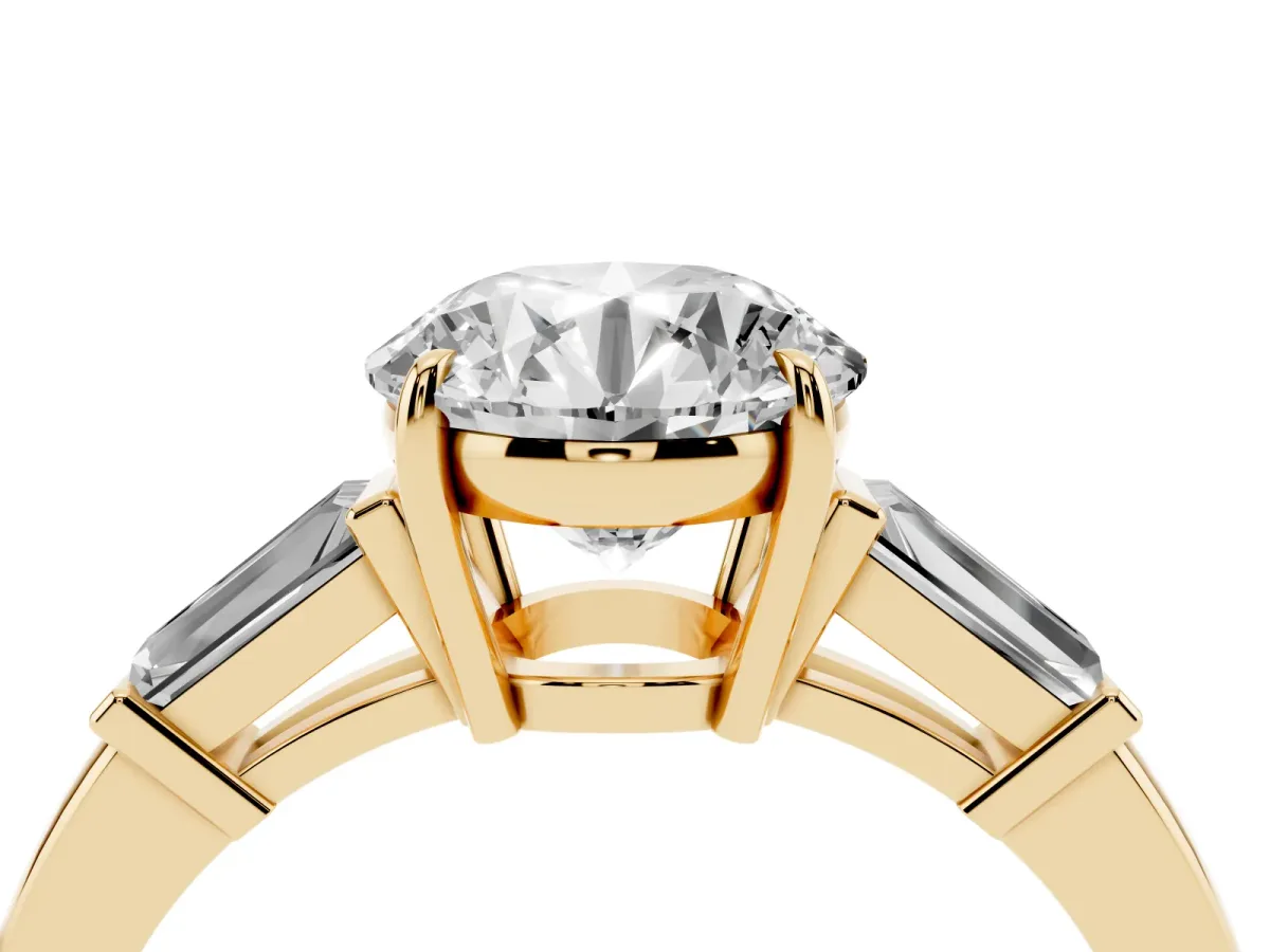 Round Cut Diamond Three-Stone Ring with Tapered Baguette Side Stones and Prong Setting Yellow gold