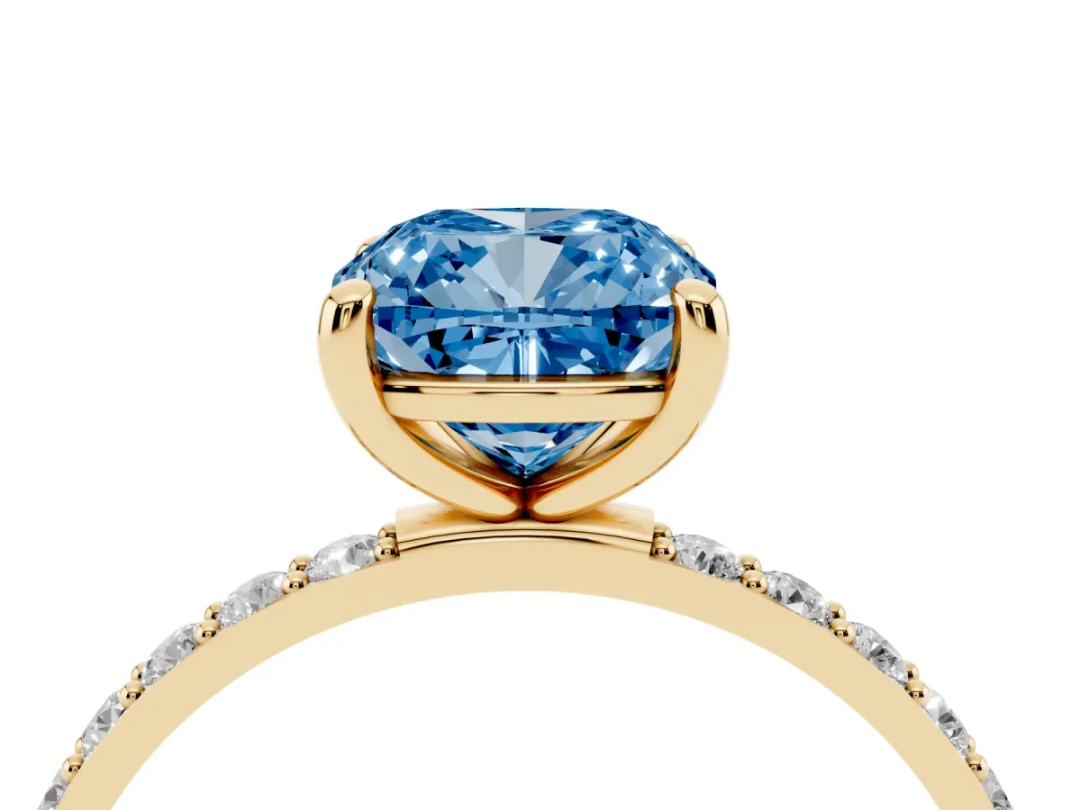 Fancy Blue Cushion Cut Diamond Solitaire Ring with Round Pavé Band and Prong Setting Yellow gold