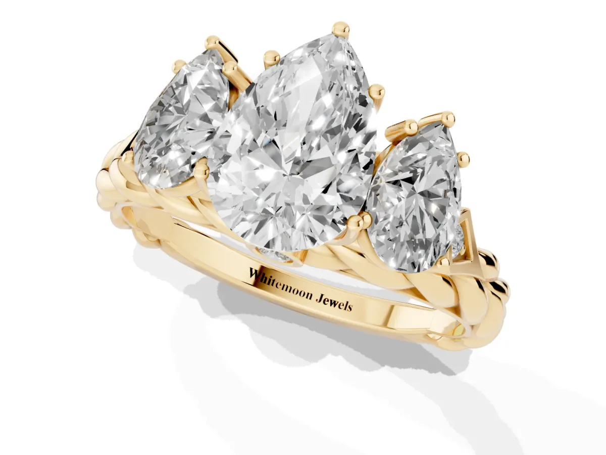 Three-Stone Pear Cut Diamond Braided Band Ring with Four-Prong Setting Yellow gold